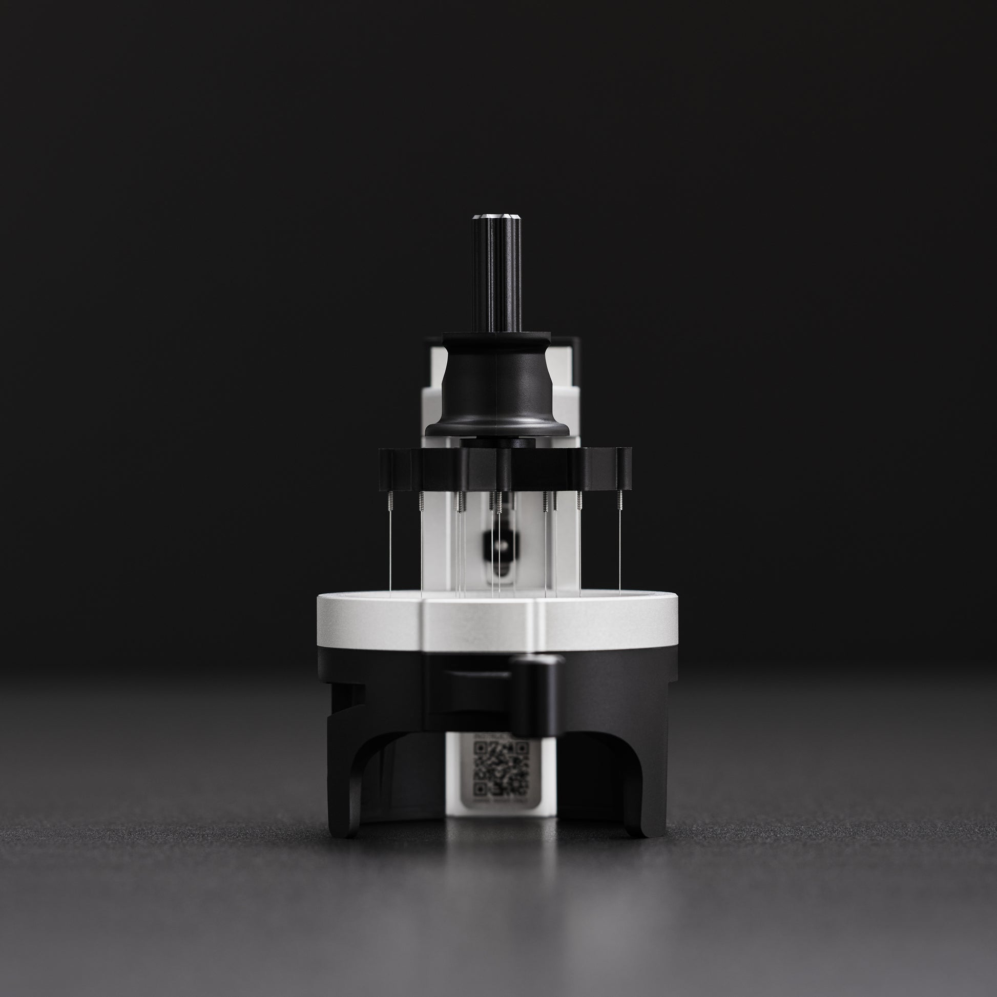 AutoComb automatic WDT tool distributing coffee grounds in espresso basket demonstration