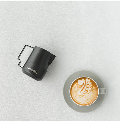MHW-3BOMBER Turbo Frothing Pitcher flat lay with espresso accessories coffee tools
