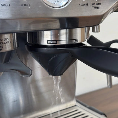 Coffee machine brush cleaner removing stubborn oil residue from group head gasket