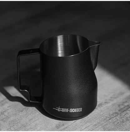 Café barista steaming milk with MHW-3BOMBER 450ml turbo pitcher commercial use