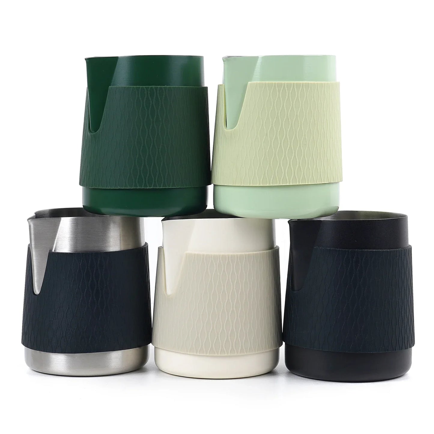 Handleless 500ml IKAPE milk frothing jug held in hand during espresso steaming session