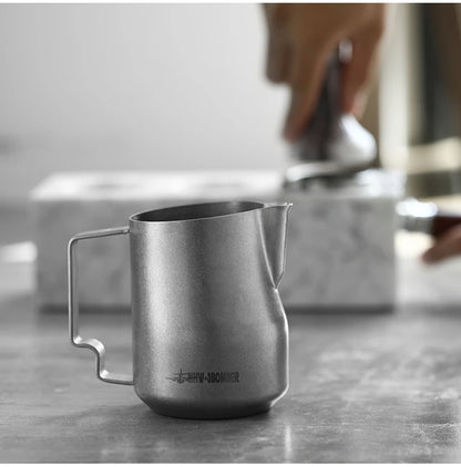 MHW-3BOMBER frothing jug gift idea for coffee lover presented on dark background