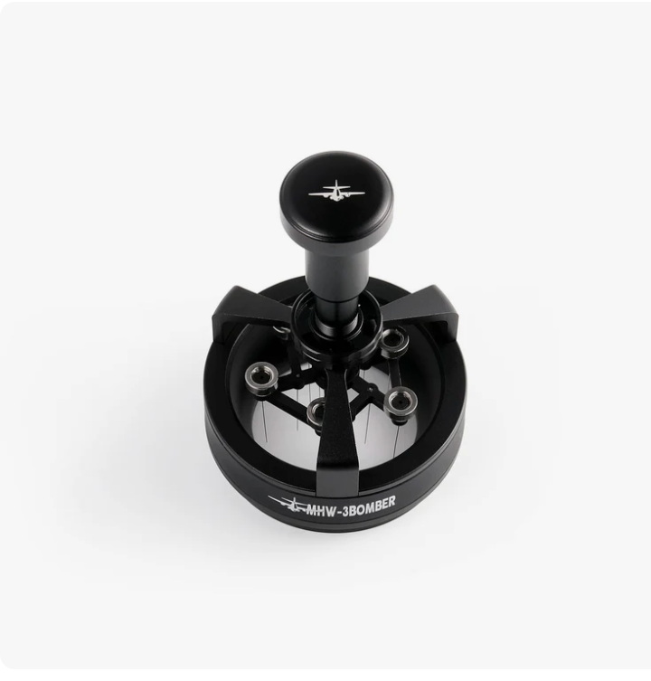 Magnetic quick-release needle head detaching from MHW Cyclone espresso powder distributor handle