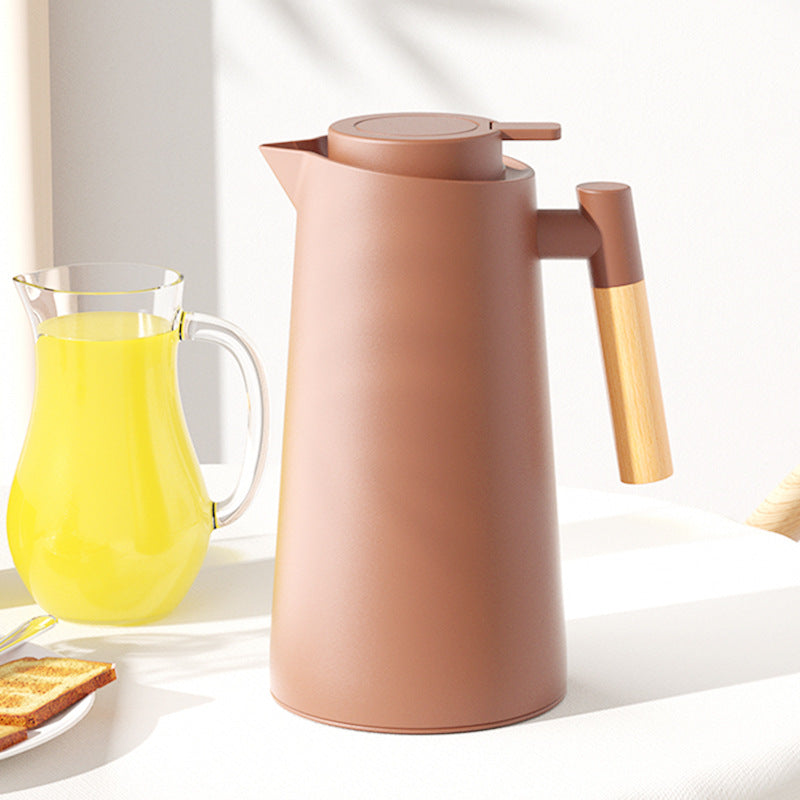 Dejess 1000ml pink thermos bottle with wooden handle on white kitchen countertop